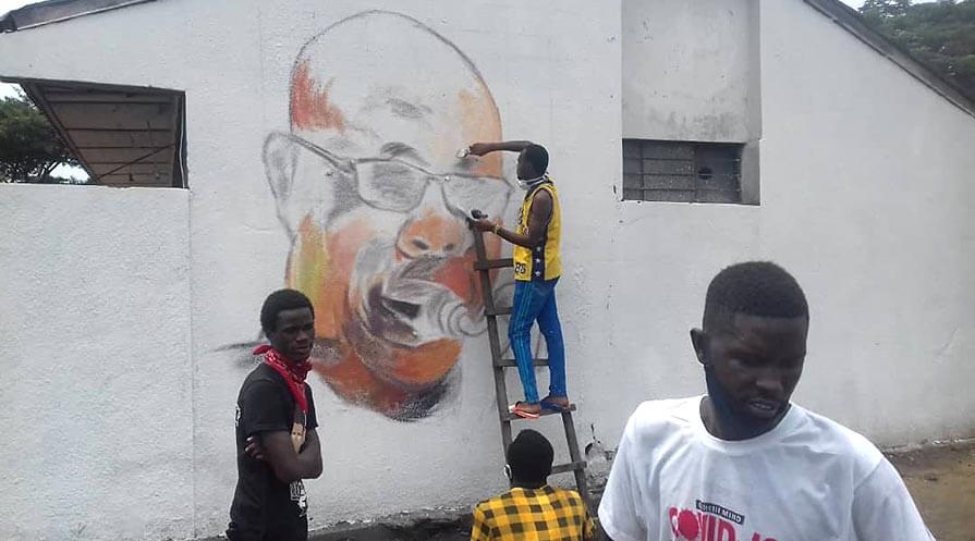 “Manu Dibango.” A group of young artists in Kinshasa worked together to paint a mural of Manu Dibango, a famous Cameroonian musician who died from COVID-19.