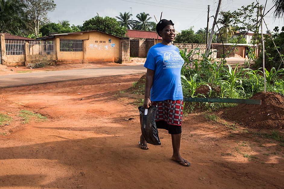 Kate Orji, a longtime volunteer in southern Nigeria, heads out into her community to distribute medications to treat river blindness and lymphatic filariasis.  