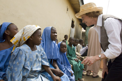 Former First Lady Rosalynn Carter greets schoolgirls suffering from schistosomiasis.