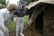 Former President Jimmy Carter and wife Rosalynn inspect a latrine in the village of Mosebo in Ethiopia. 