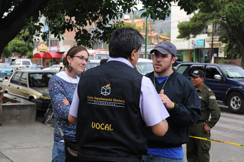 Barnes and Lederach talk with Departmental Electoral Court (CNE) officials in in Cochabamba.