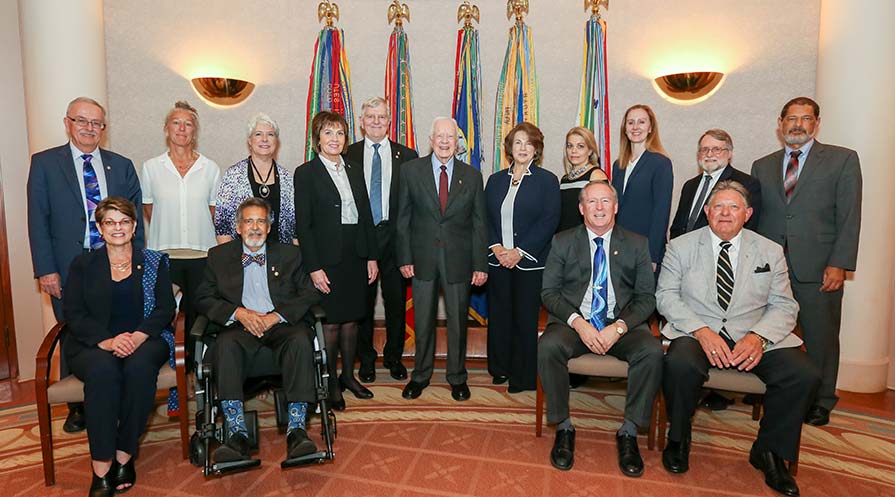 Group photo of President Carter with the Lions delegation.