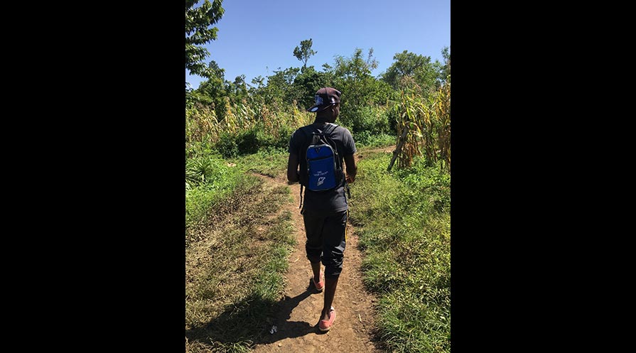 Offre willingly walks for hours at a time across the roadless mountains of Haiti.
