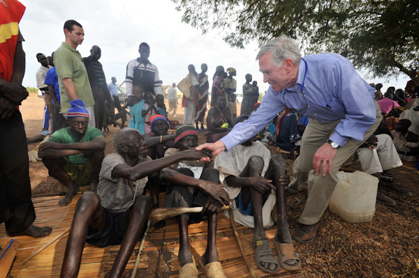 John Hardman with Sudanese villagers