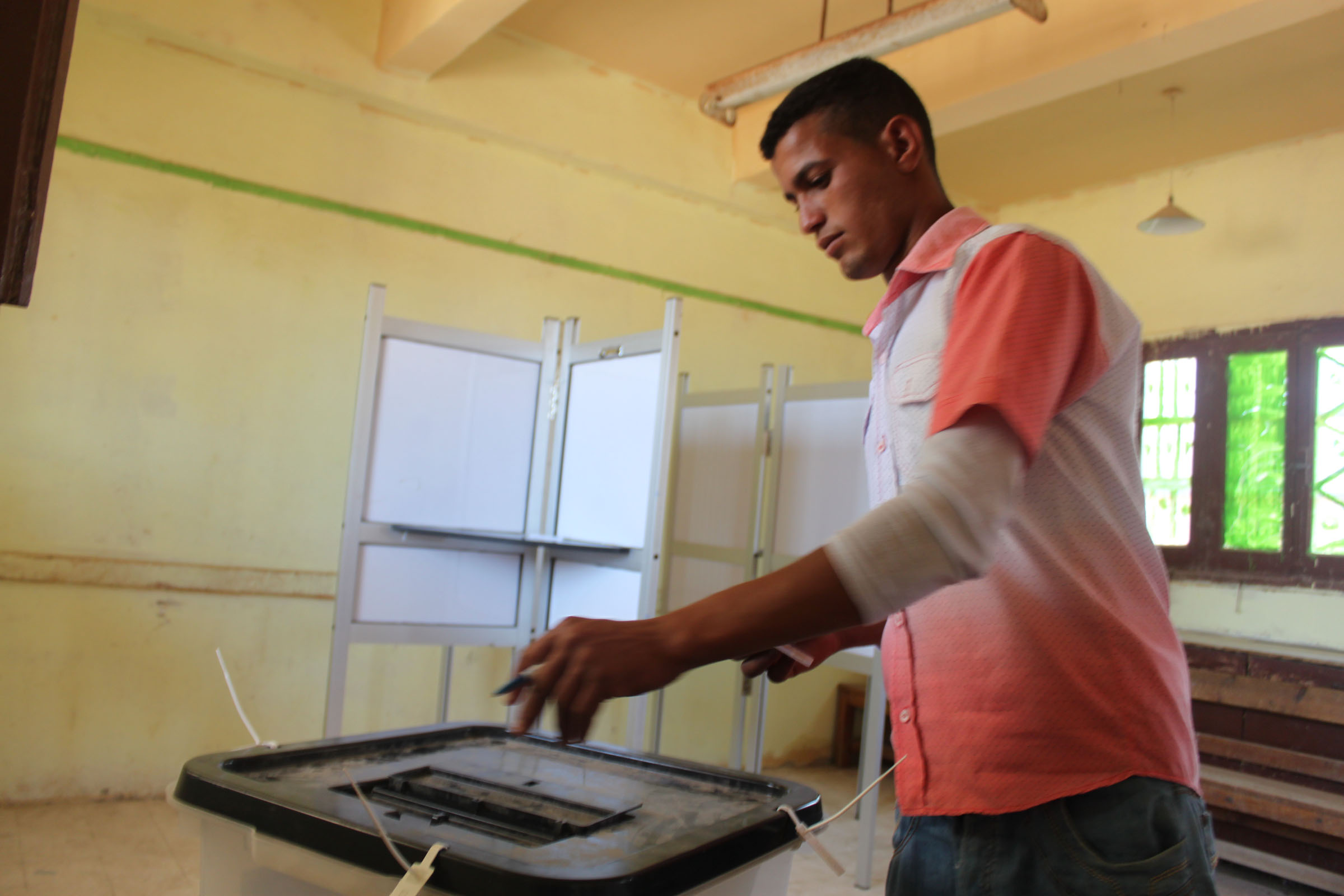 A man casts his ballot on June 16 at the Shakshouk Preparatory School in Shakshouk Village. 