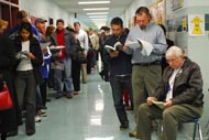 Voters wait for polls to open at a polling station in Falls Church, Va.