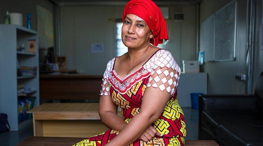 Safi Inorano is also a cleaner with two daughters living and going to school far away. Since the civil war, she can no longer dress how she likes in town, so she dresses conservatively and then changes into something more her style when she gets to work.