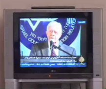Photo of President Carter speaking at the press conference.