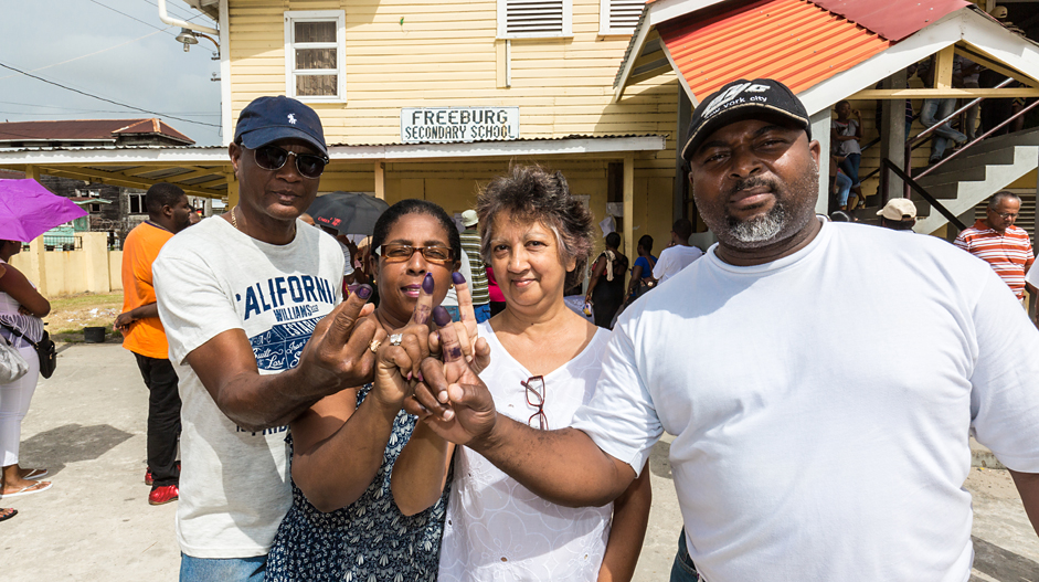New voter Kirk Embrack takes his family to vote in Guyana 