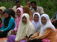 Women in Idi Tunong village, East Aceh, attend a meeting organized by the Aceh Party.