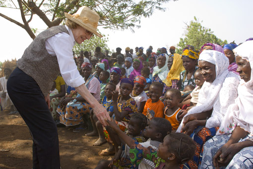 Former First Lady Rosalynn Carter greets children during a Carter Center visit to Tingoli, Ghana.