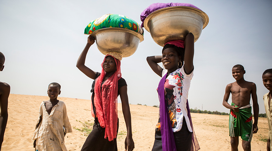 Women wash clothing in a pond off the Chari River outside of Geulengdeng, Chad.