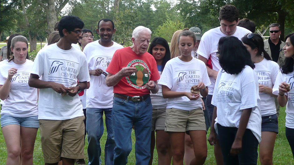 Interns walking with President Carter