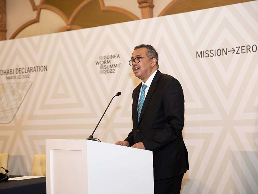 Dr. Tedros Adhanom Ghebreyesus standing at a podium in front of the event backdrop.