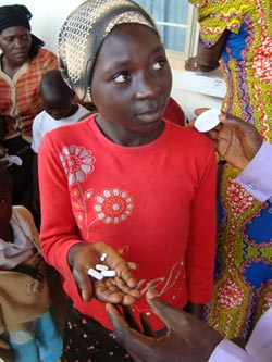 14-year-old Nigerian girl holds medication