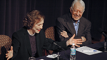 Jimmy and Rosalynn Carter speaking at a Conversations event.
